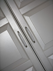 MOSCOW, RUSSIA-March 25, 2020: furniture handles from the IKEA pax series Cabinet. ivory furniture handles and white cabinets