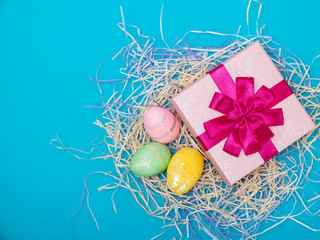 Easter eggs and chiks. Funny decoration and gift. Happy Easter. greeting cards for Easter concept on blue background