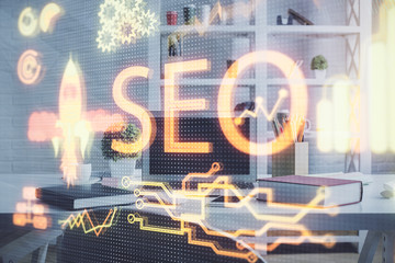 Double exposure of SEO drawing and office interior background. Concept of Search optimization...