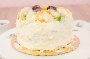 Birthday cake decorated with colorful sauce