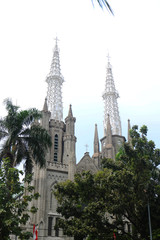 Jakarta Katredal Church is a place of worship for Christians, opposite the Istiqlal Mosque - view from Istiqlal Mosque