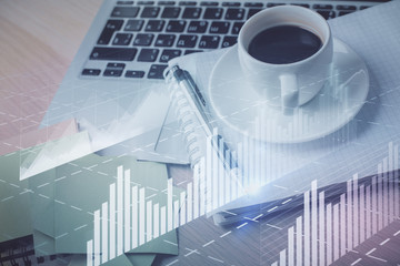 Multi exposure of forex graph drawing and desktop with coffee and items on table background. Concept of financial market trading