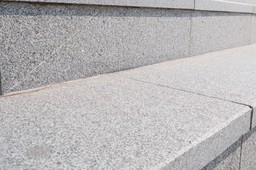 Close-up of stone steps in an urban center.
