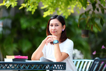 Fototapeta premium working from home effect from covid 19 virus .she working at home in garden