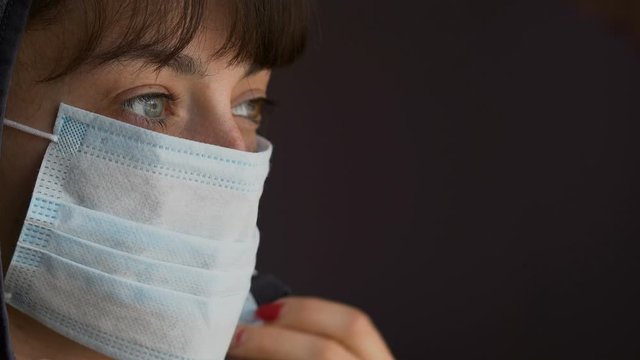 Portrait of a young woman wearing protective mask . Concept of health and safety life, coronavirus, virus protection, pandemic