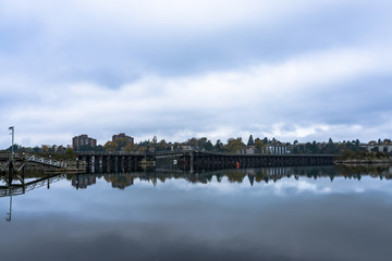Reflections of the Selkirk Trestle Bridge in Victoria on Water Like Glass