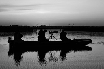 People on the boat in the dark