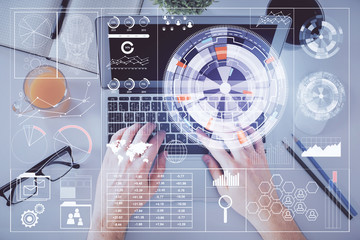 Multi exposure of man's hands typing over computer keyboard and data theme hologram drawing. Top view. Technology concept.