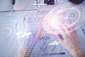 Multi exposure of man's hands typing over computer keyboard and data theme hologram drawing. Top view. Technology concept.