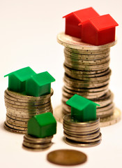 Financial inequality expressed as differences in coin height & home ownership