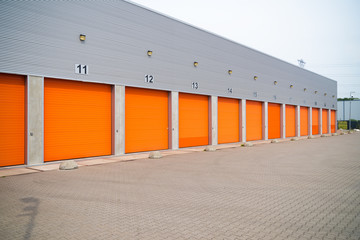 Obraz premium small business units with orange roller doors