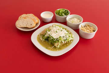 Chicken enchiladas with green sauce.
