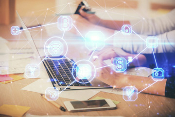 Double exposure of woman hands typing on computer and social network theme hologram drawing. People media concept.