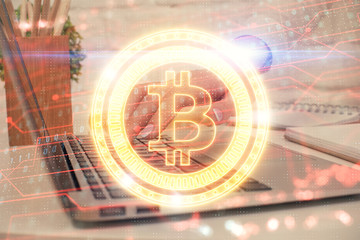 Double exposure of woman hands typing on computer and crypto market theme hologram drawing....