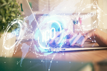 Obraz premium Double exposure of woman hands typing on computer and crypto market theme hologram drawing. Blockchain concept.