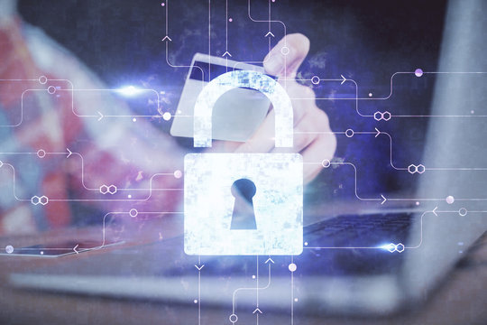 Double exposure of man hands holding a credit card and lock drawing. E-commerce and technology security concept.