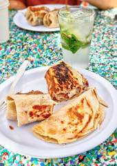 Mexican Chicken Burrito and Taco Meal With Glass of Mojito