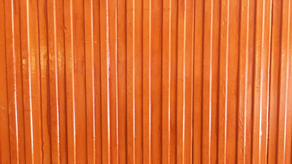 Wall. Orange color stripes ceramic wall background and texture