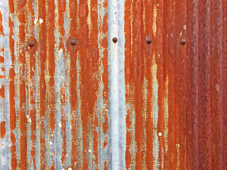 Rust on Galvanized corrugated sheet, rustic background, weathered background. Metal sheet with rusty.