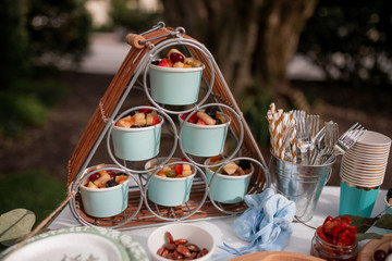 Blue cups with fruits catering for the party 
