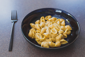 healthy plant-based food, creamy vegan shell pasta with garlic tahini sauce