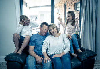 Coronavirus Outbreak self isolation. Stressed Parents struggling with kids at home in quarantine