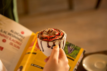 Woman drinking mocha at cafe 