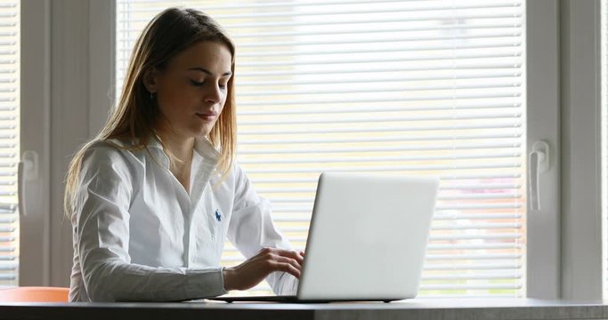unresponsive laptop computer of a young woman