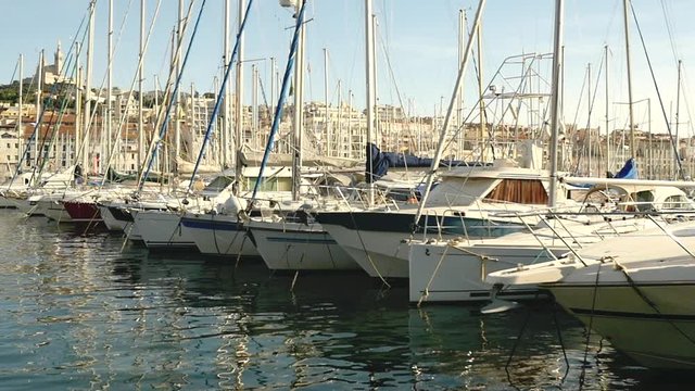 Marseille's harbor with famous Bonne M&egrave;re church in the background