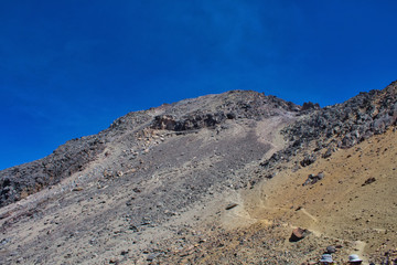 Climbing the Iztaccihuatl volcano, Popocatepetl volcano in Mexico, Tourist on the peak of high rocks. Sport and active life concept