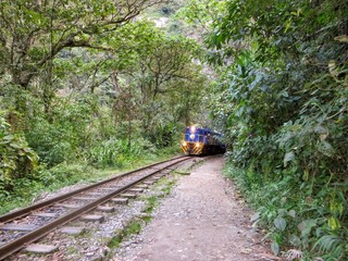 Naklejka na ściany i meble Hiking along the train tracks of Peru Rail on the road to Aguas Calientes and Machu Picchu