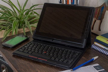 laptop on a table in a corner as a homeoffice  - macro