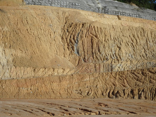 Erosion at ground and slopes is caused by rainfall. The soil structure is weak and there are landslide. Safety measure has been taken in some area.