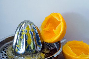 Fototapeta na wymiar citrus press with squeezed orange