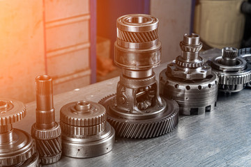 Set of various engine and gearbox spare parts. Shiny gears for planetary gearbox.Metal ...