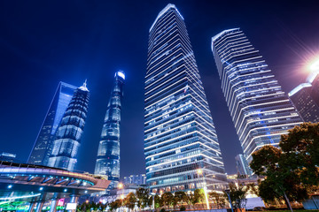 Obraz premium Office building and street night view in Lujiazui Financial District, Shanghai..