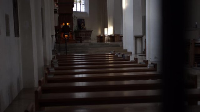 german city freising man playing organ in church