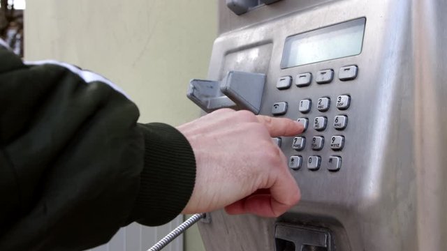 german city freising public phone taking a phonecall