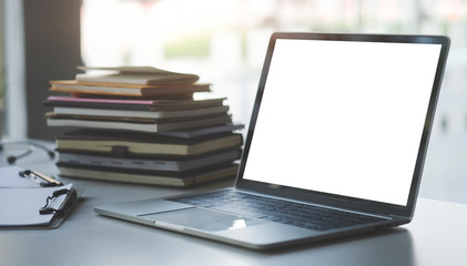 Office desk Workspace stuff with notepad, laptop and coffee cup mouse notepad shot.