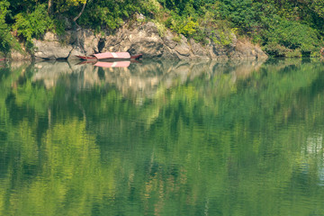 Fototapeta na wymiar A boat in the river