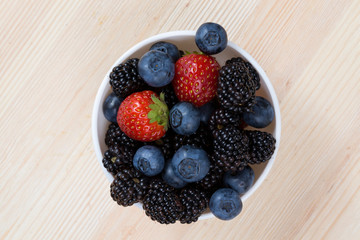 blueberries, blackberries and strawberries in a bowl