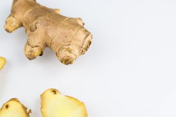 Fresh organic root ginger with slices isolated on white background. Natural anti virus medicine supports immune system