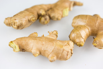 Fresh organic root ginger with slices isolated on white background. Natural anti virus medicine...
