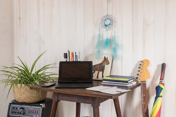 laptop on a table in a corner as a homeoffice  -  middle