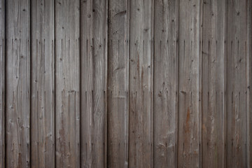 Fototapeta na wymiar Surface of dark brown wooden wall, texture of decorative old wood striped, Rustic style wallpaper. Timber texture, background with horizontal boards, texture from wooden planks.