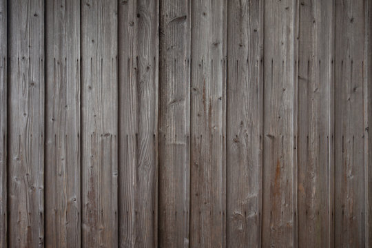 Surface of dark brown wooden wall, texture of decorative old wood striped, Rustic style wallpaper. Timber texture, background with horizontal boards, texture from wooden planks.