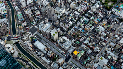 Urban Metropolitan Cityscape in Tokyo, Japan with busy skyline and dense vibrant buildings 