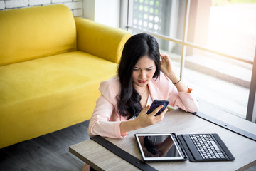 moody woman with her smartphone