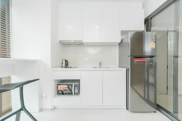 Stylish kitchen interior with dining table and chairs