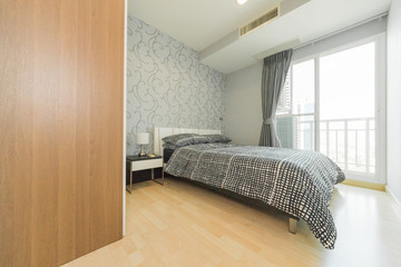 Fototapeta na wymiar Modern interior design in small apartment with bedroom